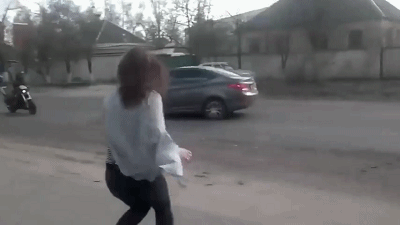 Twerking girl causes head-on crash between car and motorbike as her dancing dist.gif